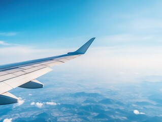 Fototapeta premium Aircraft wing against bluesky from its windows