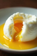 Close-up of perfectly poached egg, glossy white, yolk intact , food, clean, studio shot