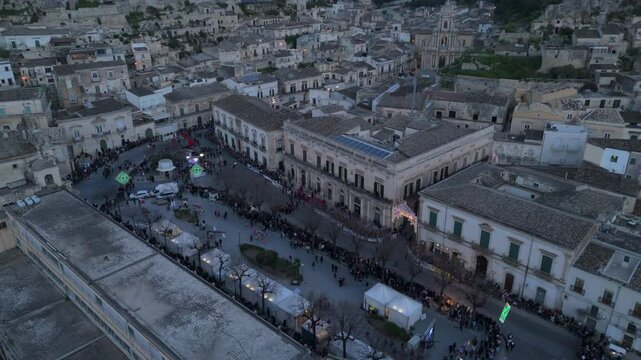 alt dusk curving back aerial view of Cavalcata in Scicli Sicily
