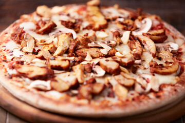 Gyros Pizza with with champignons and mozzarella cheese. Wooden background. Soft focus.	