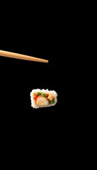 Two chopsticks delicately hold a piece of sushi against a stark black backdrop, chopsticks, appetizer, seafood
