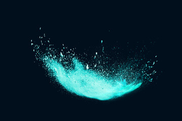 Green powder explosion on black background. Colored cloud. Colorful dust explode. Paint Holi	