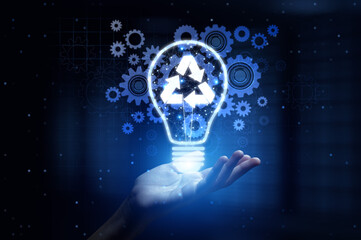 Recycle Promoting Environmental Sustainability and Waste Reduction with Human Hand Holding Lamp...