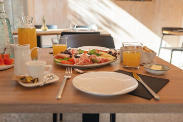 Breakfast at glamping resort restaurant surrounded by beautiful nature.