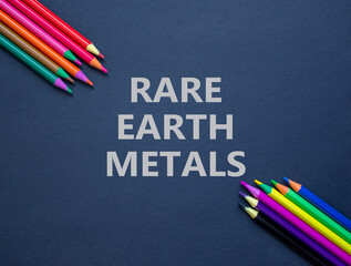 Rare earth metals symbol. Concept words Rare earth metals on beautiful black paper. Colored...