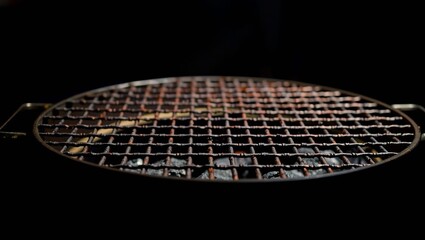 badminton racket and shuttlecock on black, bbq cooking plate, Generative AI