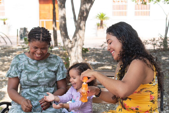 Happy Moments Blowing Bubbles Outdoors