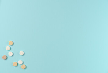 Many different pills on blue background. Flat lay, top view. Copy space