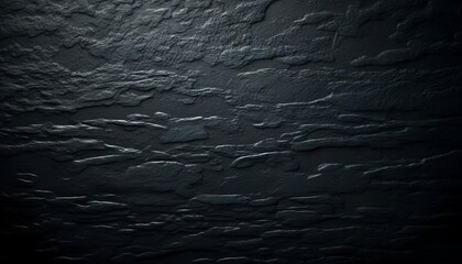Obraz premium Textured dark surface with wavy patterns in a dim light 