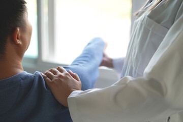 Physiotherapist doing physiotherapy for patient in a hospital room, physiotherapy helps to recover...