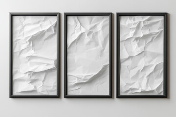 Three framed frames with crumpled paper.