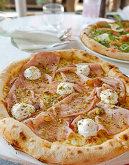 Gourmet mortadella and pistachio pizza. A delicious Italian food specialty.