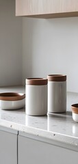 50. A set of matching kitchen canisters with sleek, minimalist designs on a counter