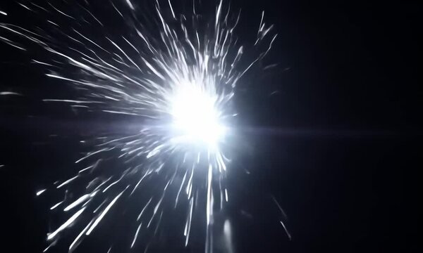 A strobe effect, bright flashing white light on a black background, random timing