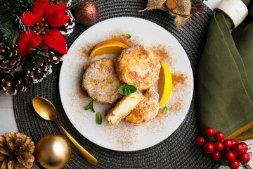 Delicious Spanish dessert LECHE FRITA traditional to prepare for the Easter holiday. Top view table with christmas decoration.