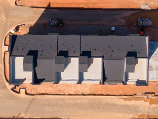 Sunny Daytime Drone Images of New Residential Townhouse Construction Featuring Architectural Asphalt Shingles: Buildings, Architecture, Industry