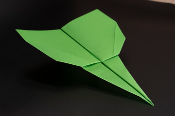 Paper airplane made of paper. Origami. Paper crafts