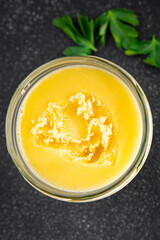 Ghee butter or clarified butter delicious gourmet food background on the table rustic food top view copy space keto and paleo diet vegetarian and vegan food