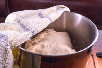 Yeast dough in a bowl.  Cooking process. Selective focus