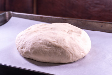 Yeast dough in a bowl.  Cooking process. Selective focus