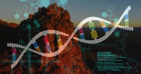 DNA helix and data animation over rocky mountain landscape at sunset - Powered by Adobe