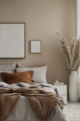 Cozy bedroom with neutral tones, pampas grass, and textured bedding.