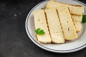 Sandwich soft cheese Camembert or Brie fresh delicious gourmet food background on the table rustic food top view copy space