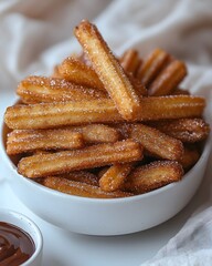 Golden churros with cinnamon sugar and chocolate dipping sauce
