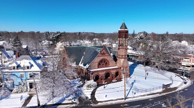 First Baptist Church aerial view in winter with Richardsonian Romanesque Revival style at 1299 Centre Street in Newton Centre, Boston metropolitan, Massachusetts MA, USA.