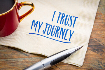 I trust my journey - positive affirmation on a napkin with coffee