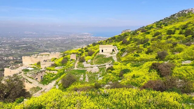 A breathtaking panoramic video captures the stunning Gulf of Corinth from the top of Acrocorinth in Peloponnese, Greece, showcasing sweeping views of the sea, mountains, and historic ruins.