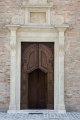 A dramatic shot of the entrance to a historic church in Rimini, Italy.
