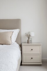Serene Beige Bedroom Interior with Nightstand and Dried Flowers