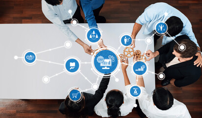 A dynamic business team engages in a collaborative meeting, utilizing technology concepts to...