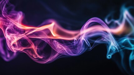 Obraz premium Colorful smoke swirls and flows against a dark background beautifully