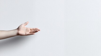 Hand Outstretched White Wall Background Showing Gesture of Offering or Presenting