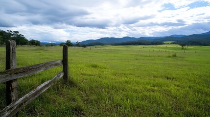 Obraz premium Lush Green Landscape Under Dramatic Sky Capturing the Beauty of Nature and Tranquility : Generative AI