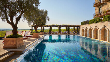 Fototapeta premium Hotel in the south with an outdoor pool - AI generated