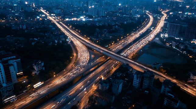 Fototapeta Stunning aerial view of a busy city highway at night with flowing traffic lights and urban skyline : Generative AI
