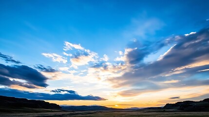 Fototapeta premium Stunning sunset over rolling hills with colorful clouds showcasing nature's beauty during twilight : Generative AI
