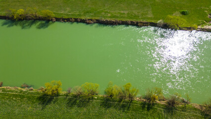 Aerial drone view of Park Jarun in Zagreb, showcasing stunning blue water, lush greenery, and the nearby Sava River Park features excellent bicycle roads, perfect for cycling and outdoor activities