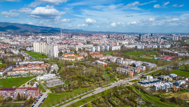 Aerial drone view of Park Jarun in Zagreb, showcasing stunning blue water, lush greenery, and the nearby Sava River Park features excellent bicycle roads, perfect for cycling and outdoor activities