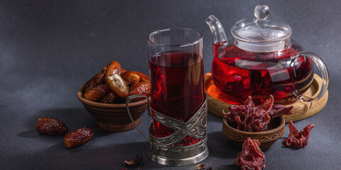 Hibiscus hot tea with dates. Traditional Ramadan Kareem concept snack for Iftar or Suhoor meal