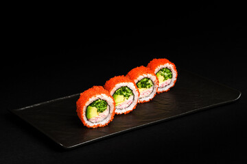 Delicious Fresh Salmon Sushi Rolls Presenting Exquisitely on a Black Background