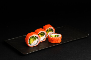 Delicious Fresh Salmon Sushi Rolls Presenting Exquisitely on a Black Background