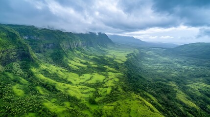 Fototapeta premium Stunning aerial view of lush green mountains under a cloudy sky displaying nature's breathtaking beauty : Generative AI