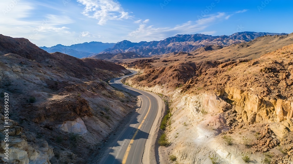 Poster aerial view of a winding road through rugged desert mountains under a clear blue sky : generative ai
