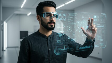 Indian man interacts with virtual display in modern office. He uses future technology for data analysis, innovation, virtual reality, touching holographic interface.