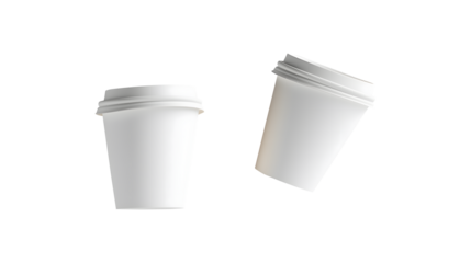 Two white paper cups are floating in the air
