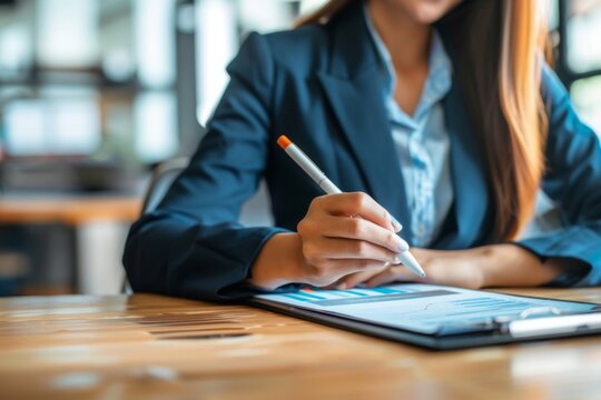 An HR recruiter is reviewing candidate applications on a tablet in a recruitment center